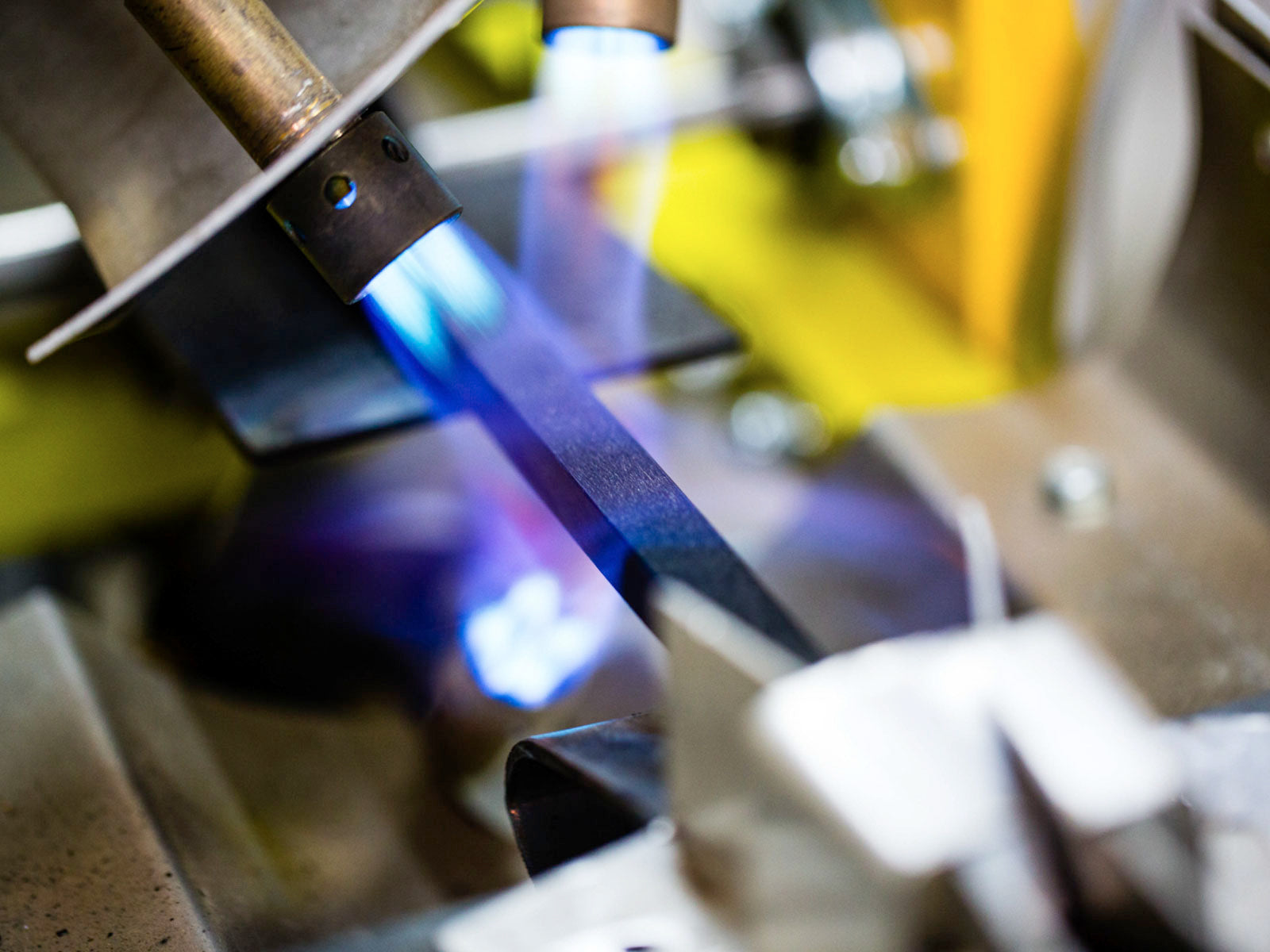 A full-height UHMW sidewall strip being bonded to a core.